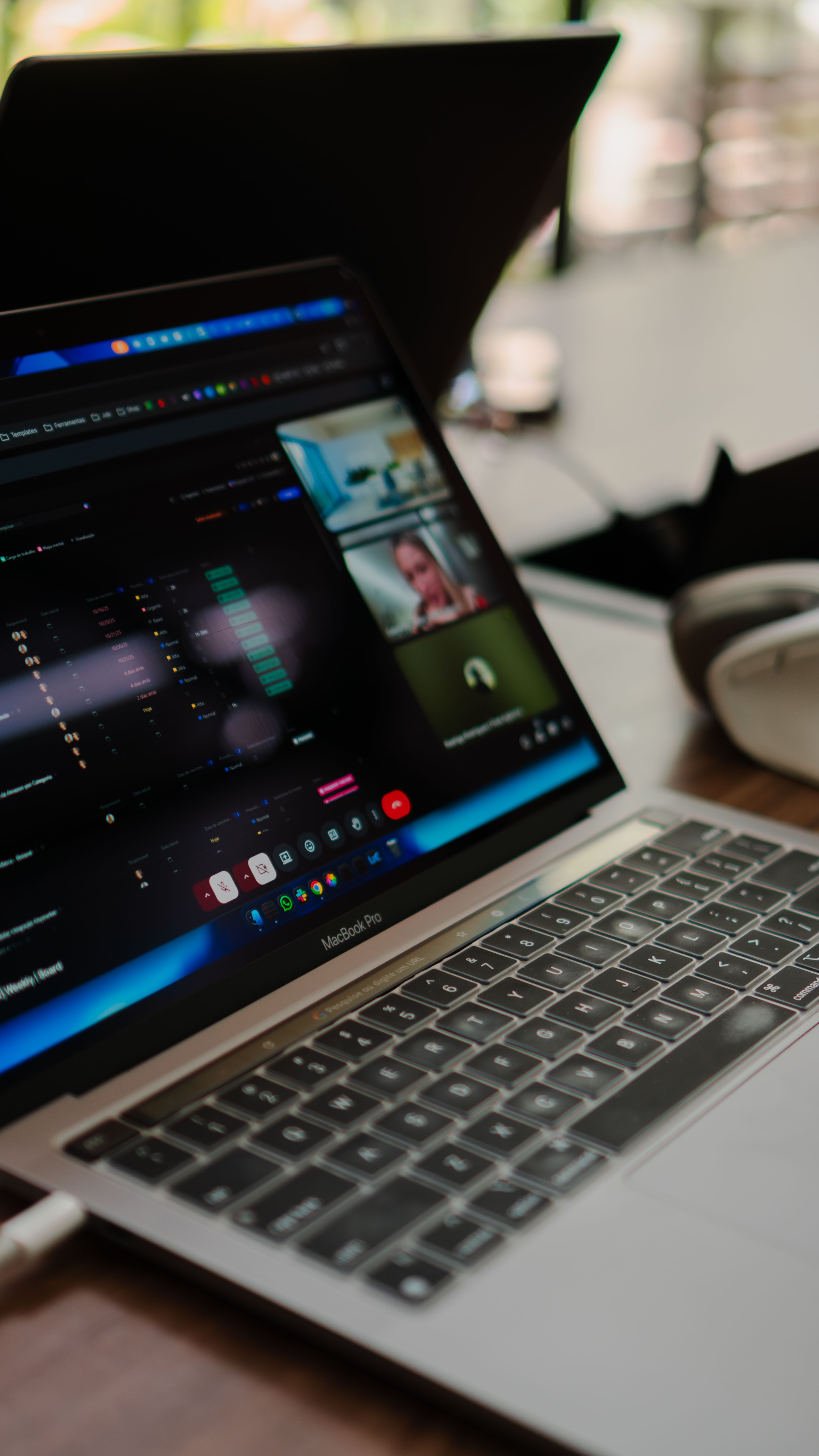 Professionals coordinating a creator partnership around a shared workspace