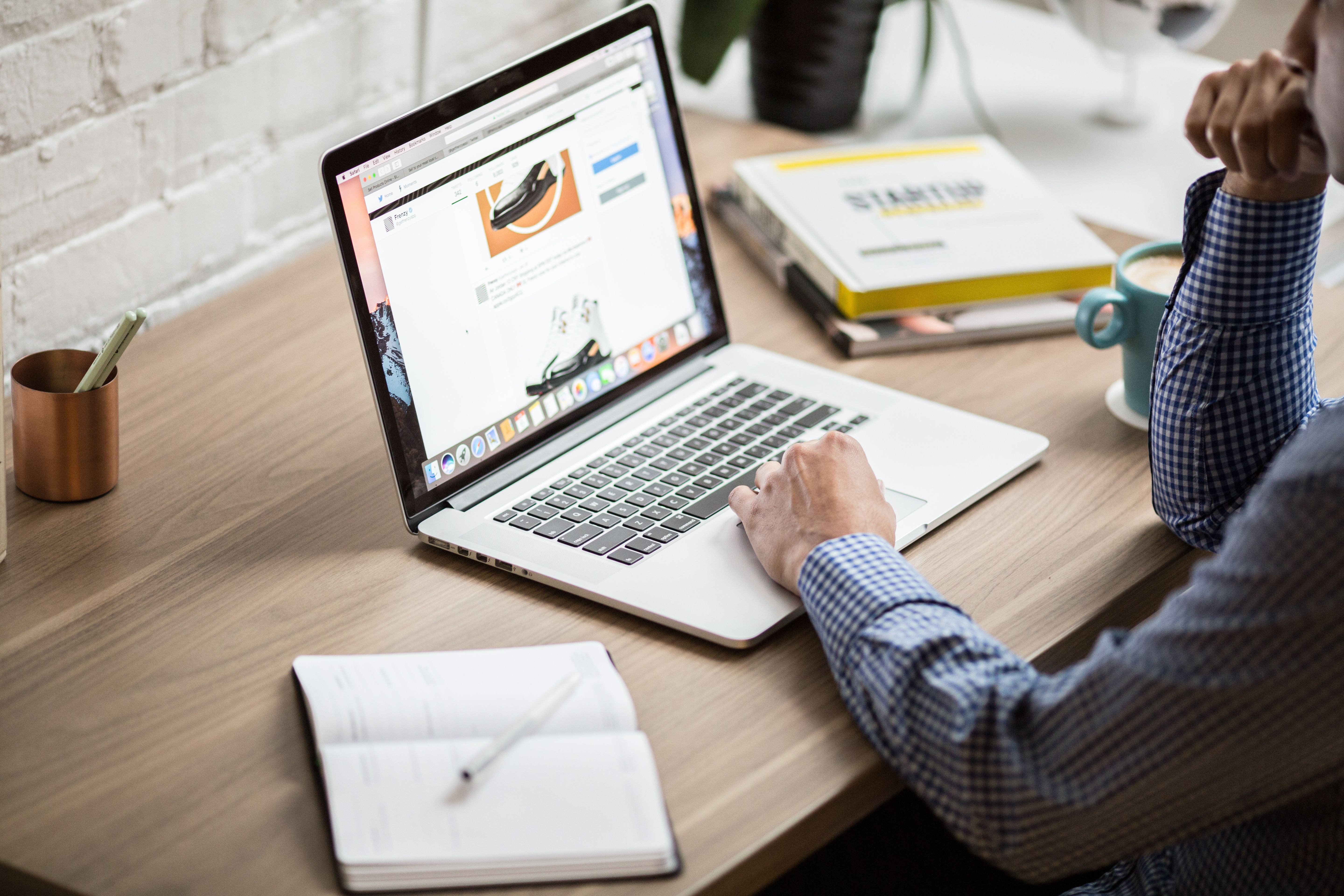Professional reviewing a digital opportunity on a laptop