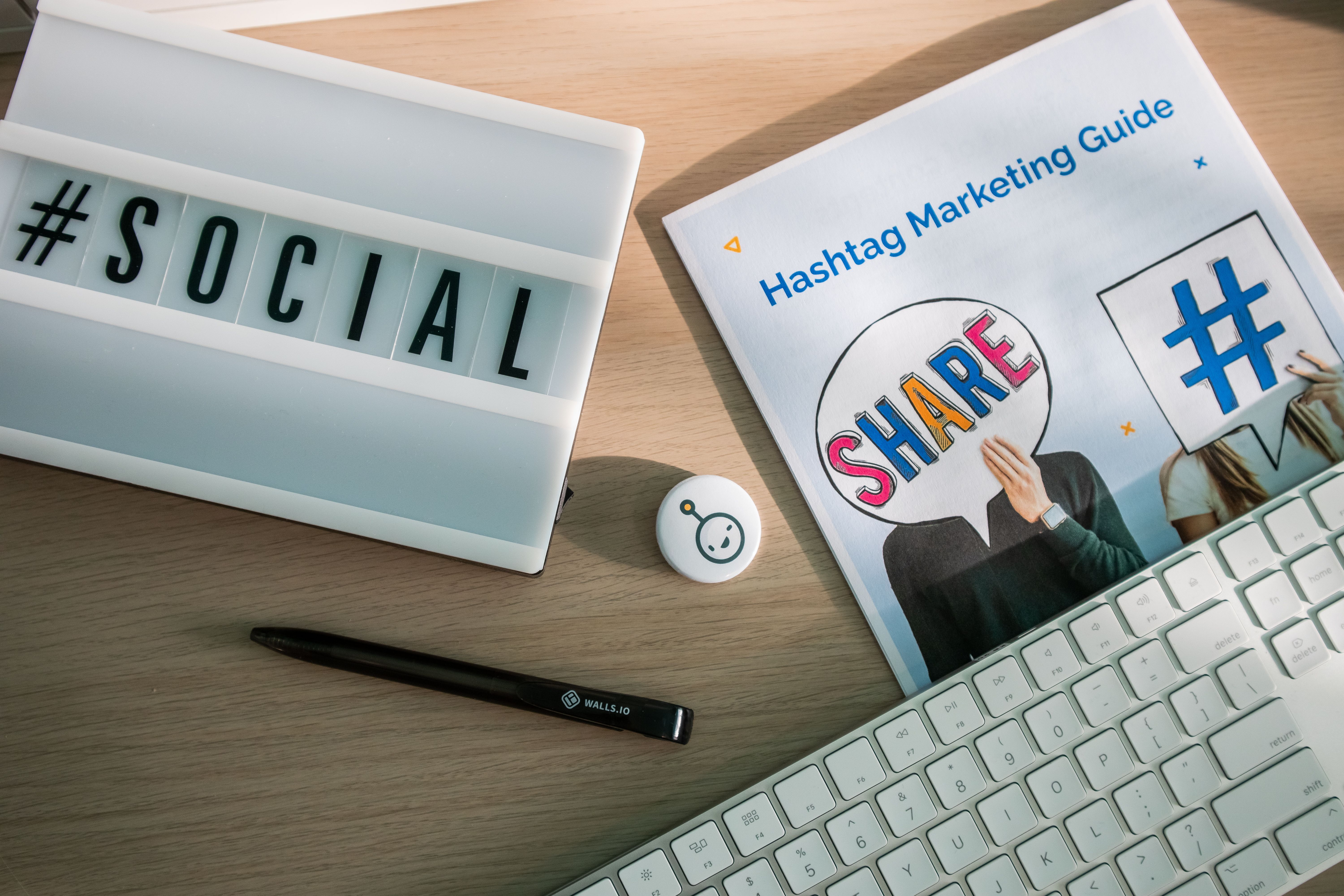 Social media marketing guide and campaign planning materials on a desk
